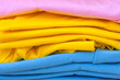 © O.PASH - Folded t-shirts different colours. Sportswear in the store. fabrics