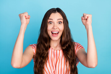 Sticker - Photo of astonished shocked lady celebrate victory rejoice wear striped blouse isolated blue color background