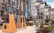 Children playground house building facade mixed-use urban multi-family residential district area settings