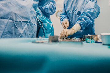 Wall Mural - Medical team preparing surgical equipment for operation inside private clinic - Focus on right nurse hand