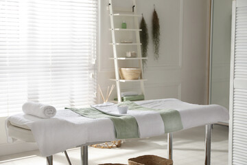 Canvas Print - Stylish spa salon interior with massage table