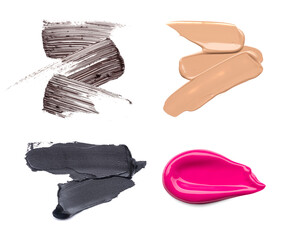 Wall Mural - Set of cosmetic products. Smear of pink lipstick, brown smear of mascara and black eyeliner, foundation smears of makeup isolated on white background.