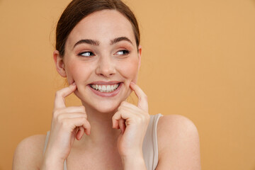 Wall Mural - Close up portrait of a smiling young woman