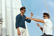 © Drobot Dean - Young male friends resting on yacht in sea