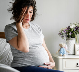 Wall Mural - Pregnant woman with a headache