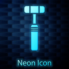 Poster - Glowing neon Neurology reflex hammer icon isolated on brick wall background. Vector Illustration