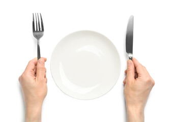 Sticker - Top view of woman with cutlery and empty plate on white background, closeup