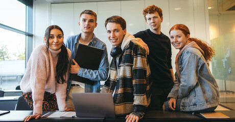 Wall Mural - Group of young people in classroom