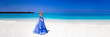 Summer fashion. Elegant fashion model. Glamour, stylish sexy blonde female model in elegant long dress on the Maldives beach. Travel model. Elegance. Bride and wedding on Maldives. Bridal.