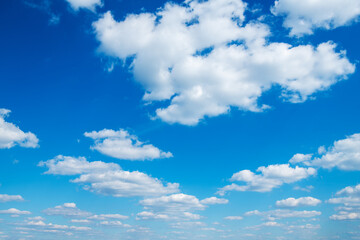 Wall Mural - White clouds in blue sky.