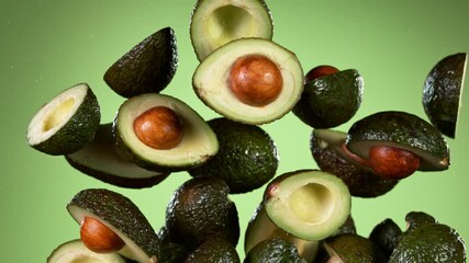 Poster - Super slow motion of fresh avocados flying in the air on gradient background. Filmed on high speed cinema camera, 1000 fps.