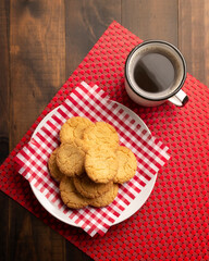 Wall Mural - Top view of Homemade crunchy cookies and a coffee cup on wooden rustic table