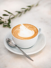 Poster - Cappuccino coffee drink in white cup with latte art top