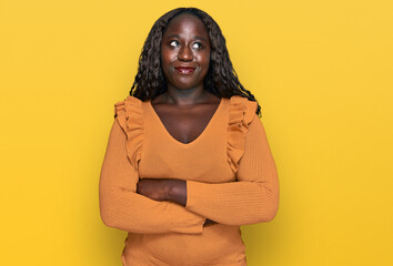 Poster - Young african woman wearing casual clothes smiling looking to the side and staring away thinking.