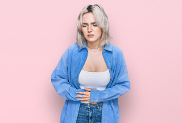 Poster - Young blonde girl wearing casual clothes with hand on stomach because indigestion, painful illness feeling unwell. ache concept.