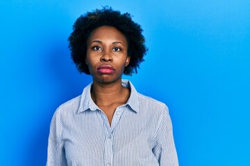 Sticker - Young african american woman wearing casual clothes relaxed with serious expression on face. simple and natural looking at the camera.