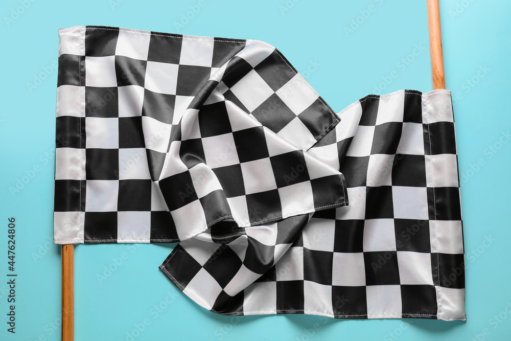 Racing flags on color background