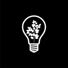 Wall Mural - Light bulb with leaf icon isolated on dark background