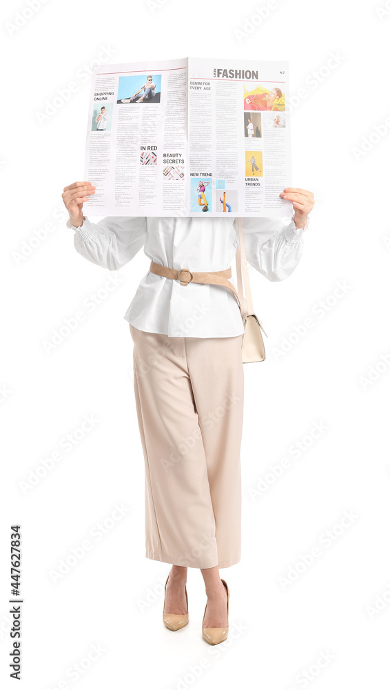 Young woman reading newspaper on white background