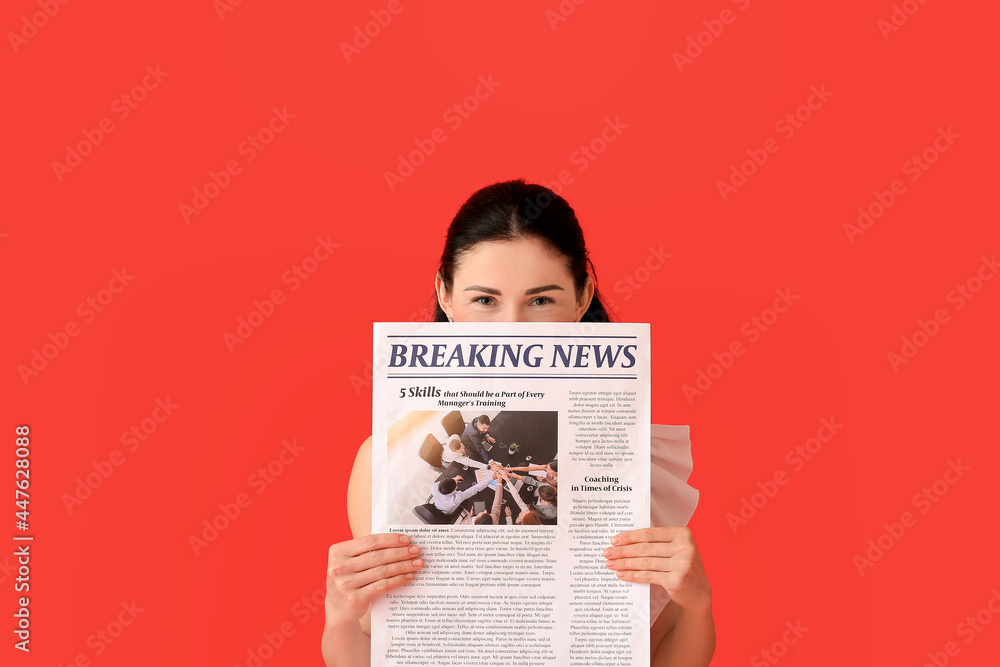 Beautiful woman with newspaper on color background