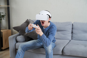 Wall Mural - man with virtual reality headset is playing game.