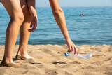 Fototapeta Tulipany - Plastic bottle is on the beach left by tourist