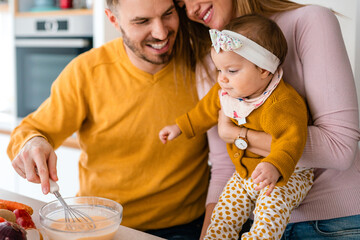 Wall Mural - Happy family with children playing and cuddling at home