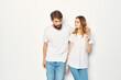 © SHOTPRIME STUDIO - man and woman in white t-shirts are standing next to family light background