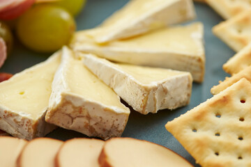 Wall Mural - sliced cheese on a plate 