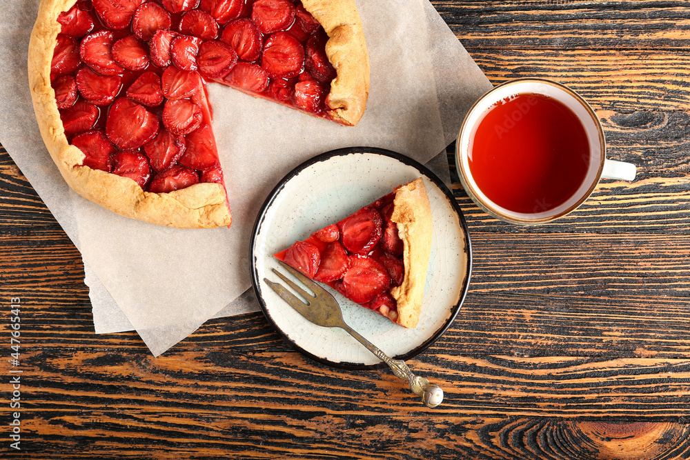 Composition with tasty strawberry pie on wooden background