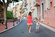 © Tomsickova - Cute blond child and mom, toddler boy and parent, walking in Monaco ville street, hand in hand