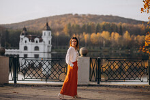 Woman By The Castle And Lake Posing
