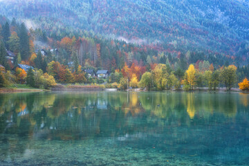 Wall Mural - Amazing nature autumn landscape, Jasna lake in Triglav national park, Kranjska Gora, Slovenia. Scenic view of crystal clear pond with reflection, tourist resort, outdoor travel background