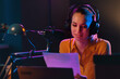 © StockPhotoPro - Young radio presenter broadcasting news