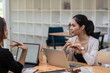 © amnaj - Young Asian businesswoman meeting working together at the office.