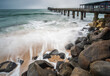 © Travel 'n' Lifestyle - View of ocean waves crashing on the rocks near Swakopmund Jetty, a popular tourist spot, Namibia, Africa.