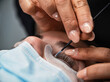© ADDICTIVE STOCK - Beauty specialist doing eyelash lamination to client