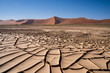© Travel 'n' Lifestyle - Cracked mud pan in Namib-Naukluft National Park, a popular travel destination in Namibia, Africa.