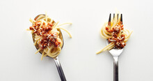 Top View Of Spaghetti Bolognese In A Fork And Spoonin The Light Background
