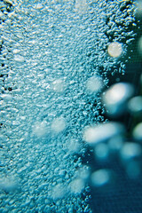 Wall Mural - foamy water in blue water pool 