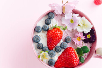 Poster - Close-up shot of cup of ice cream with strawberry, blackberry and decorative flowers