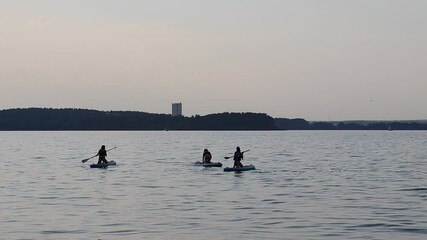 Wall Mural - supboard training at lake in Belarus