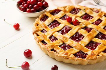 Wall Mural - Tasty cherry pie on light wooden background, closeup