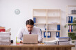© Elnur - Young male employee and too much work in the office