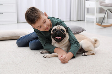 Sticker - Boy with his cute pug on floor at home