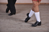 Close-up of a man and woman dancing traditional Irish dances. Legs of dance partners