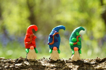 Canvas Print - Figurines of three colorful dwarfs made of plasticine.