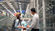© Pixza - Couple Asian people walking in airport terminal waiting for  flight boarding to travel by air