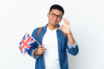 Young Ecuadorian woman holding an United Kingdom flag isolated on white background showing ok sign with fingers