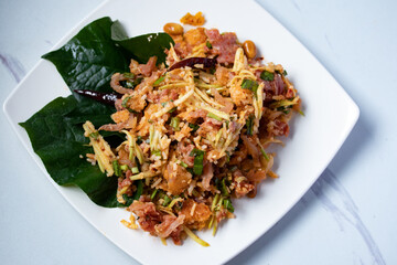 Spicy Salad of Curried Rice Croquettes Fermented Pork, Ginger and Peanuts.(Yam Naem Khao Thot)